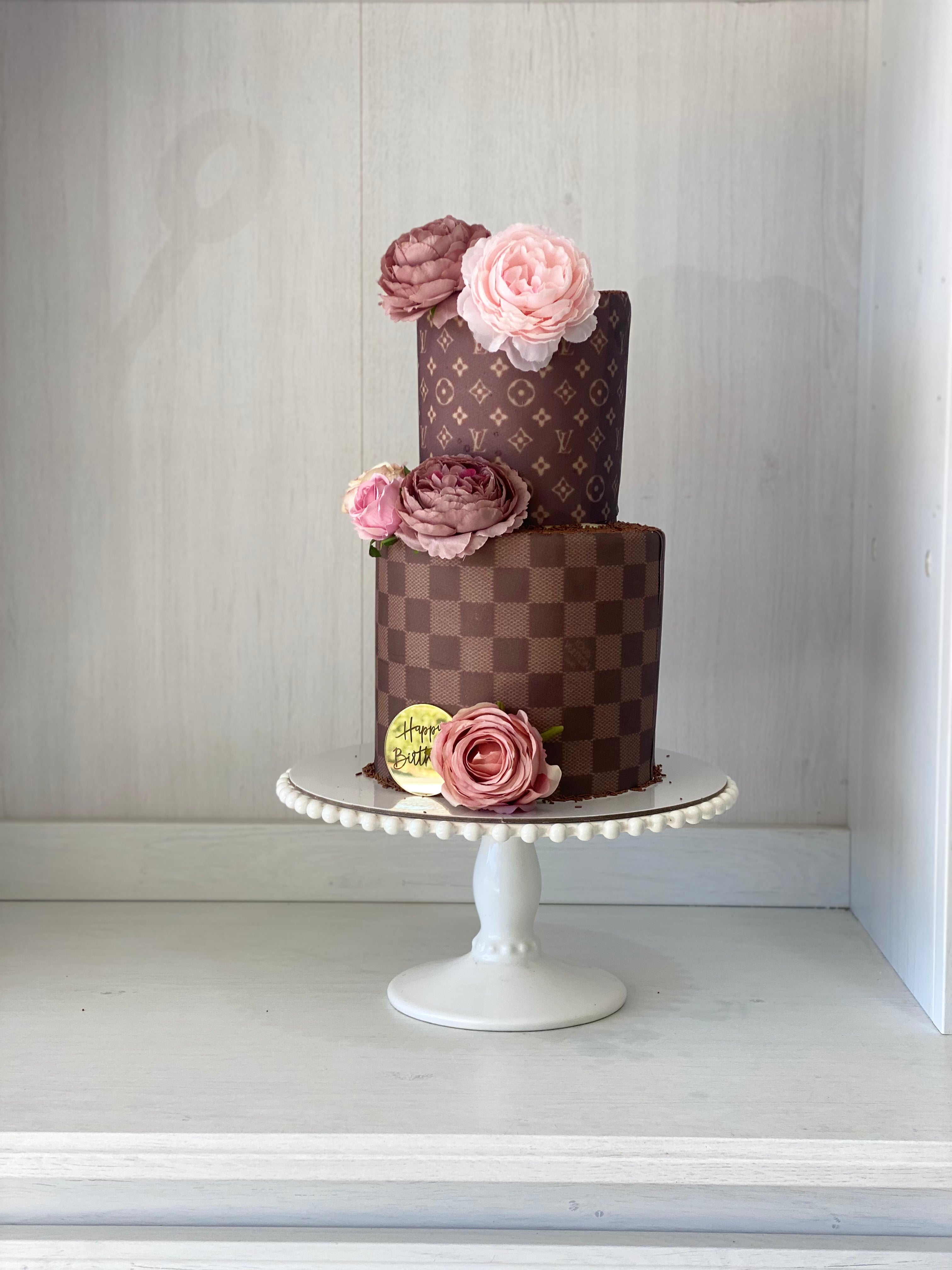 2 tiered Louis Vuitton birthday cake, iced in buttercream, with