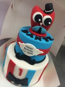 2 tier red and blue owl cake